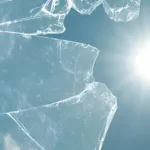 A broken glass with sun shining through