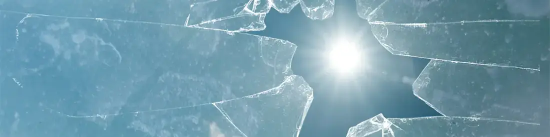 A broken glass with sun shining through